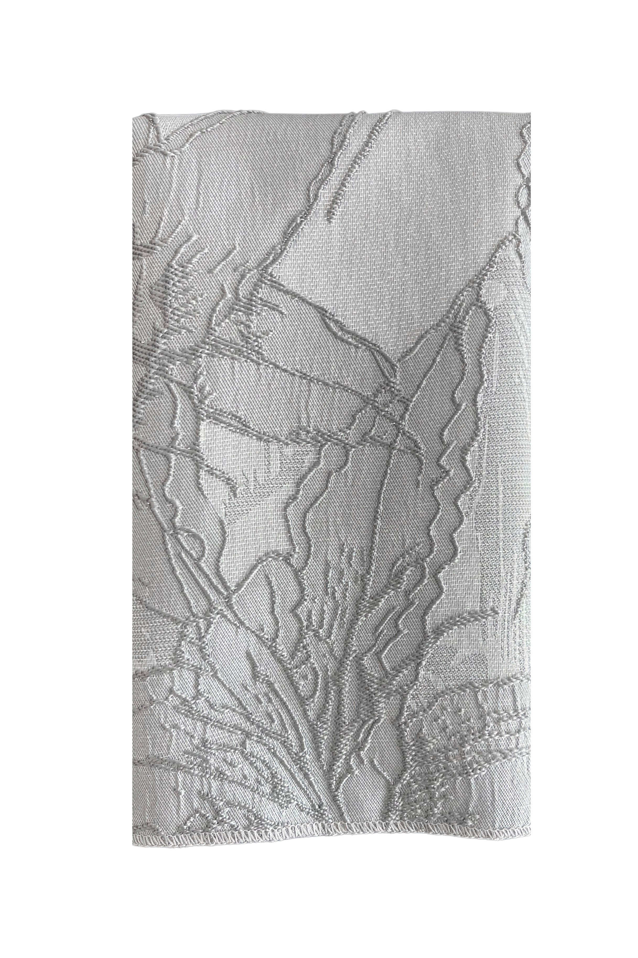 Grey Fabric Napkin with a lily floral embroidery pattern in metallic stitching 